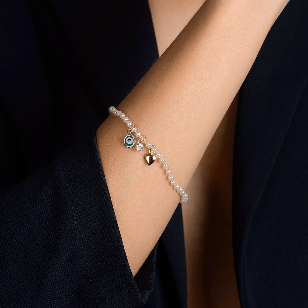Pulseira Dourada de Pérolas com Olho Grego Coração e Ponto de Luz - Galeria
